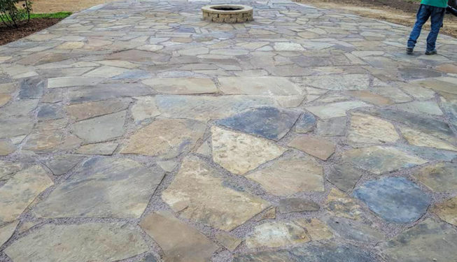 flagstone patio sitting area with fire-pit